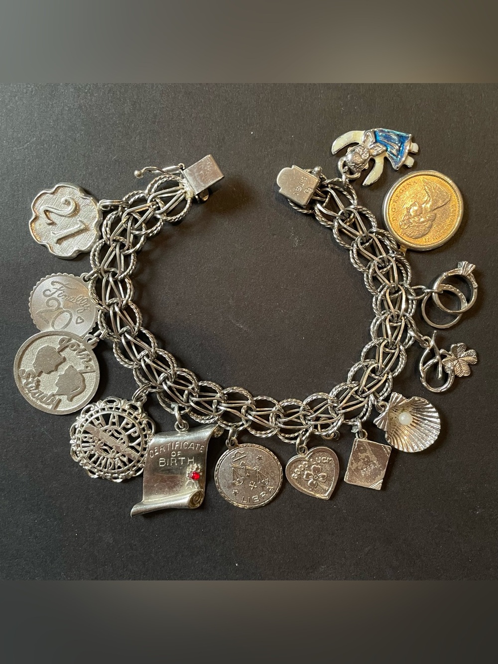 Vintage Sterling silver Charm Bracelet with 13 Assorted Charms.